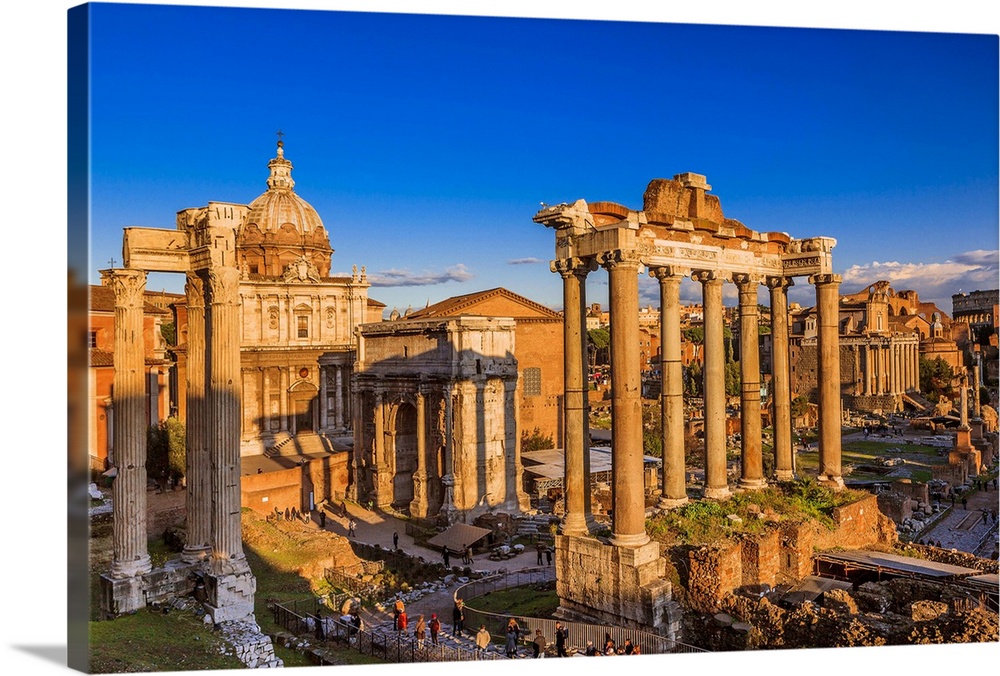 Italy, Latium, Roma district, Rome, Roman Forum, Foro Romano Temple of Saturn and Arch of Septimius Severus.