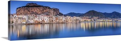 Italy, Sicily, Palermo district, Cefalu, Harbor and old town at sunset