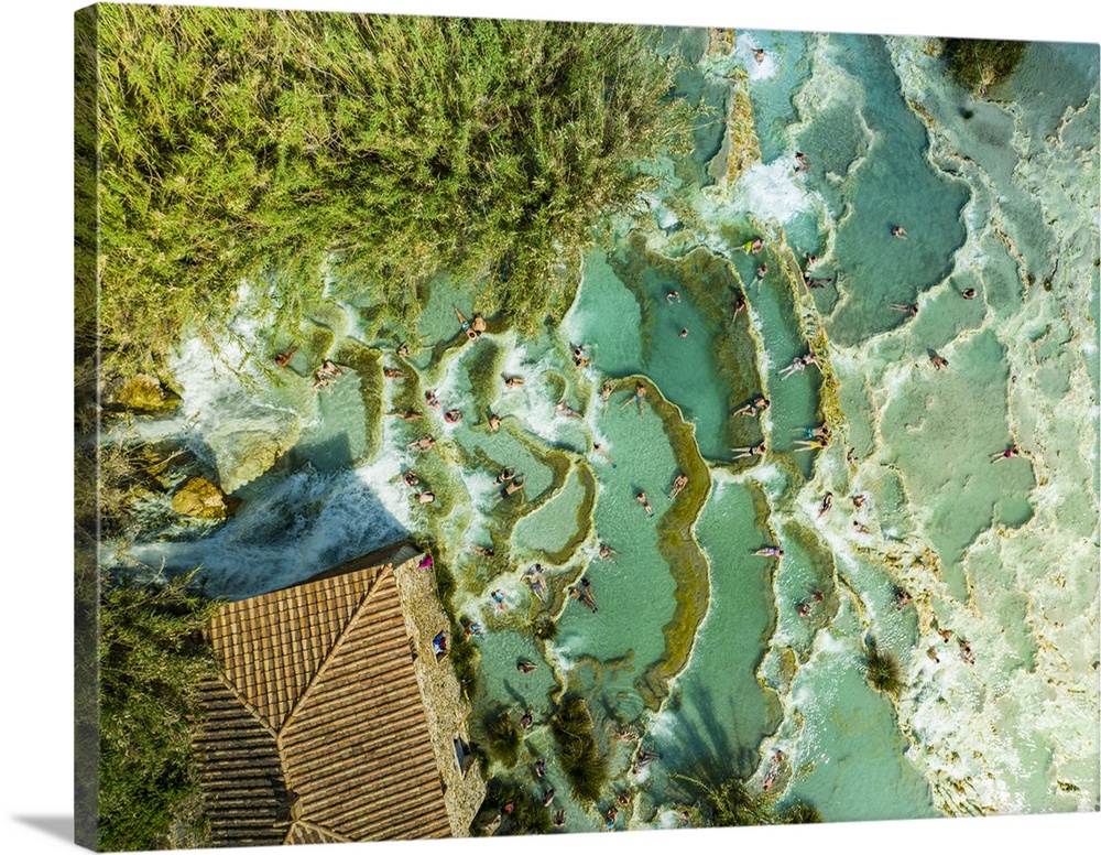 Italy, Tuscany, Grosseto district, Maremma, Saturnia, Amazing top view of the Saturnia thermal baths full of people relaxi...