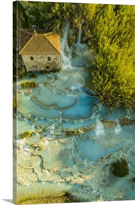Italy, Tuscany, Maremma, Saturnia, The Saturnia Thermal Baths Surrounded By Trees