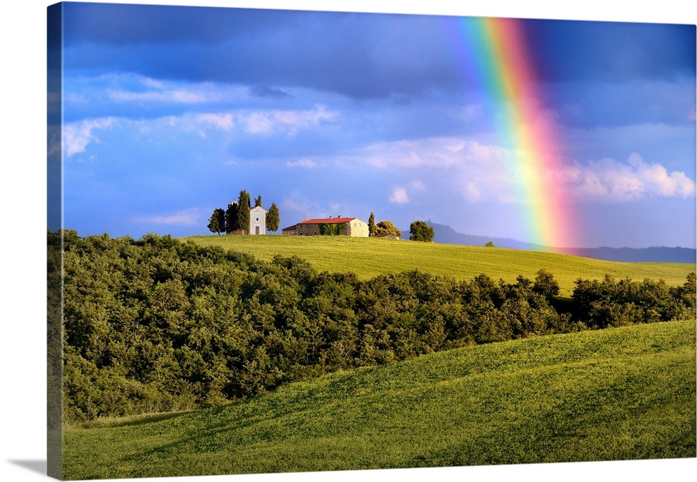 Italy, Tuscany, Siena district, Orcia Valley, the Chapel of Vitaleta with a rainbow over it.