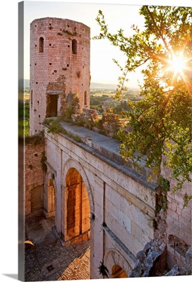 Italy, Umbria, Spello, Porta Venere (gate) and Torri di Properzio (towers) at sunset