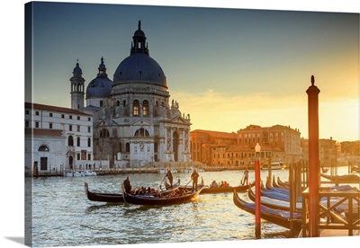 Italy, Venice, Gondolas And The Santa Maria Della Salute Church At Sunset