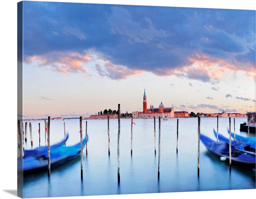 Italy, Venice, San Giorgio Maggiore, Gondolas on the waterfront of Saint Mark Basin with San Giorgio in the background.