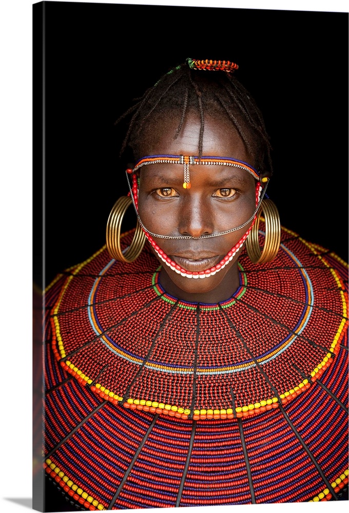 Kenya, Central, Pokot girl in traditional clothing.