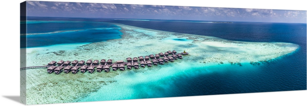 Maldives, Ari Atoll, Indian ocean, South Alifu Atoll, breathtaking aerial view of Moofushi reef and the suspended houses i...