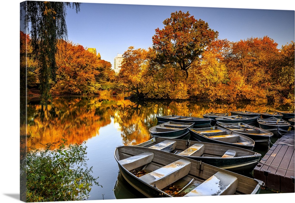 USA, New York City, Manhattan, Central Park, Lake with boats and foliage