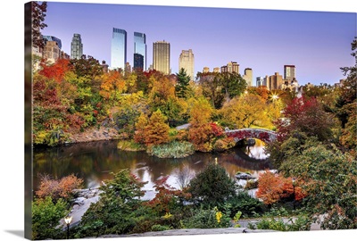 Manhattan, Central Park, Midtown Skyline And Gapstow Bridge During The Foliage