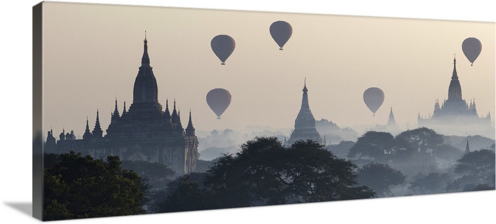 Myanmar, Mandalay, Bagan, Hot air balloons flying over the Buddhist temples in the plain of Bagan.