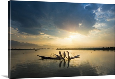 Myanmar, Shan, Nyaungshwe, Three Local Fishermen In Silhouette At Sunrise