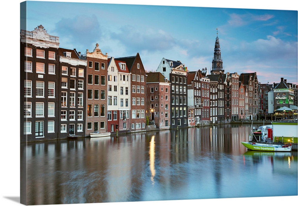 Netherlands, North Holland, Amsterdam, Typical Dutch houses along the Damrak Canal.