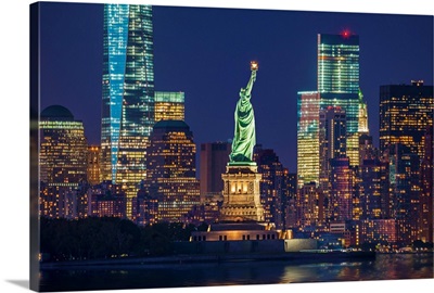 New York City, Liberty Island, Manhattan Skyline And Statue Of Liberty At Night