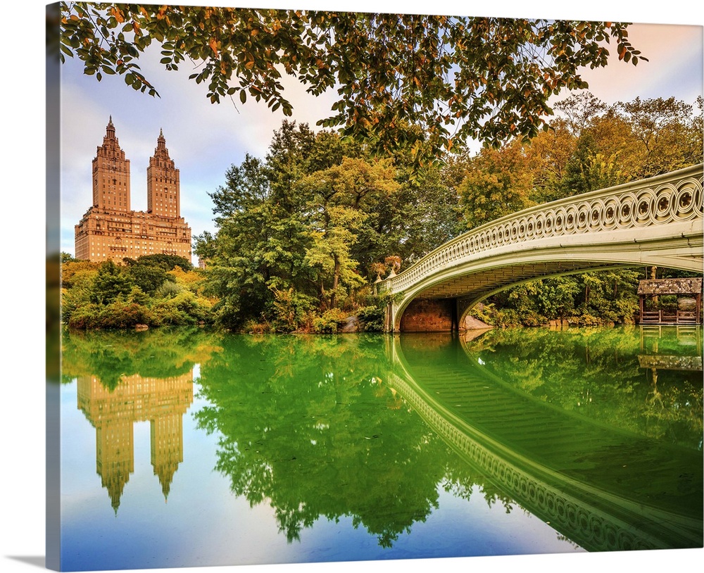USA, New York City, Manhattan, Central Park, Bow Bridge in Central Park, with view of San Remo Apartment towers, sunrise.