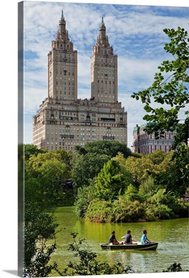 New York City, Manhattan, Central Park, People on a boat with San Remo Building