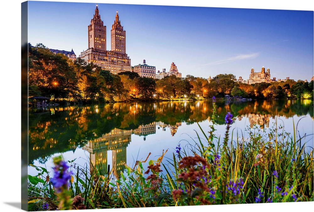 USA, New York City, Manhattan, Central Park, the lake Apartment Building The San Remo, sunset.