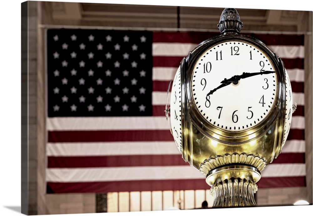USA, New York City, Manhattan, Midtown, Grand Central Station, Brass Clock and the US flag.