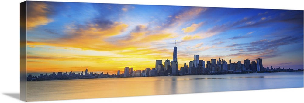 USA, New York City, Manhattan, Lower Manhattan, One World Trade Center, Freedom Tower, City skyline at sunrise.