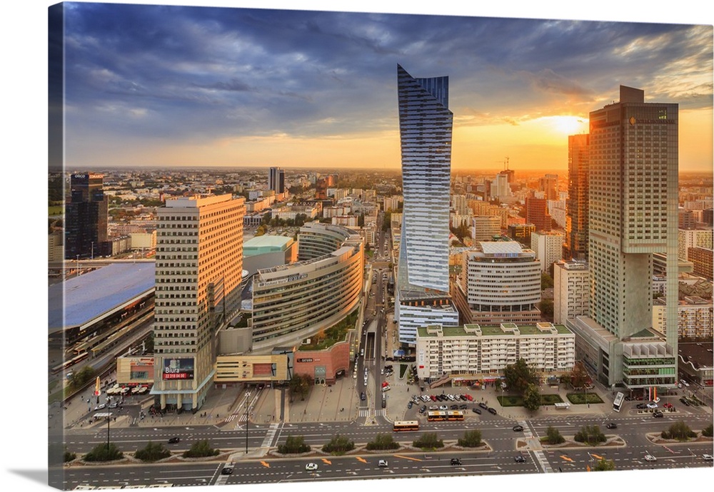 Poland, Masovia, Warsaw, Zlote Tarasy shopping centre and Zlota 44 residential tower at sunset.
