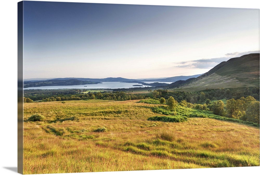 UK, Scotland, Loch Lomond, Great Britain, Field with the Conic Hill in the background at dusk.
