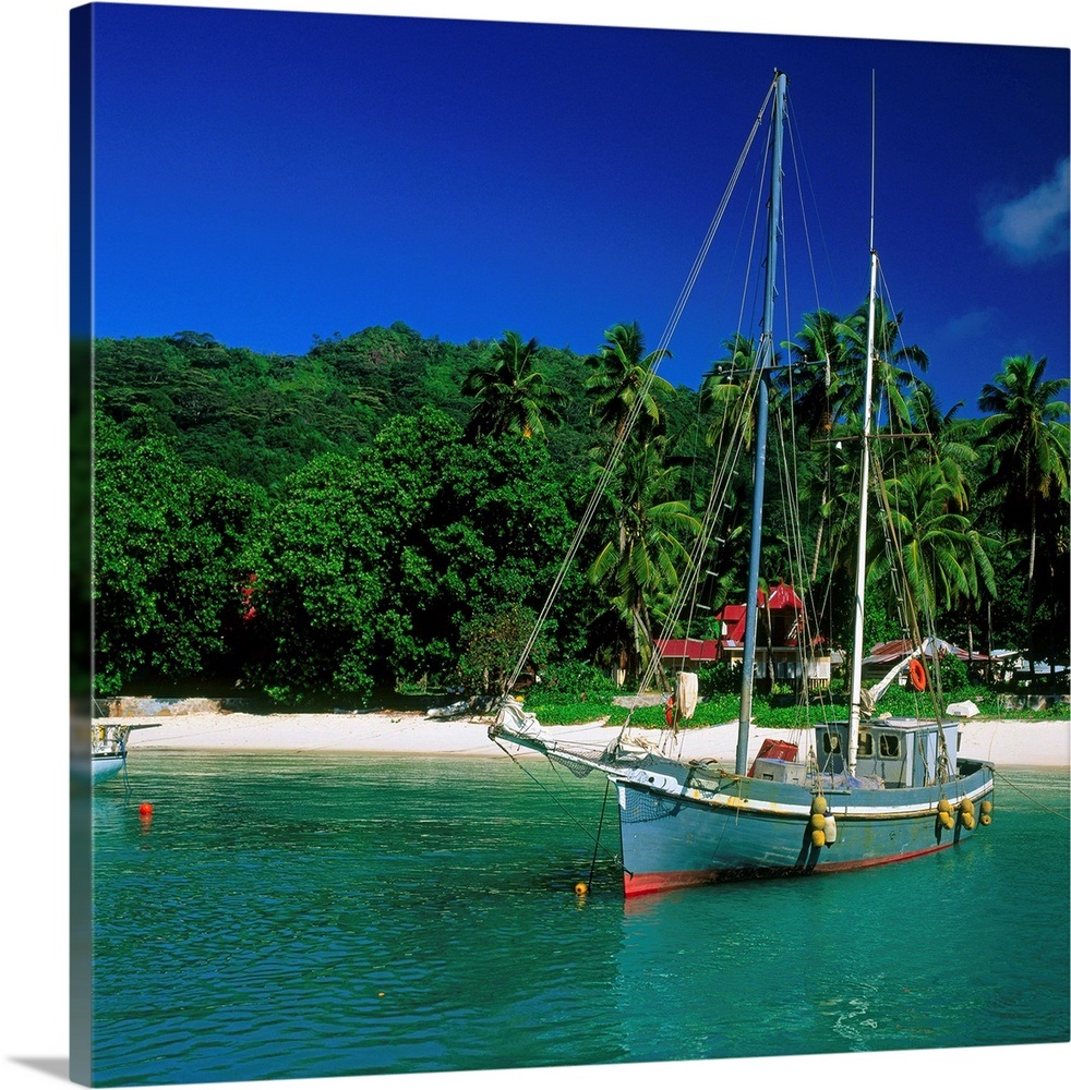 Seychelles, La Digue, sailing boat in the small harbor Wall Art, Canvas