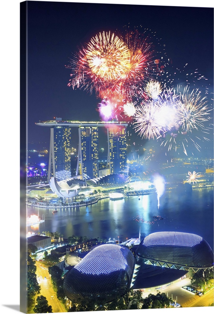 Singapore, Singapore City, Chinese New Year fireworks at Singapore marina, Marina Bay Sands in the background.