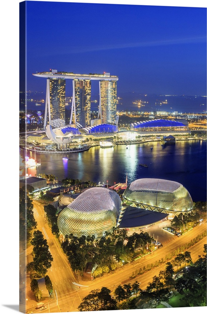 Singapore, Singapore City, Singapore marina with Marina Bay Sands at night.