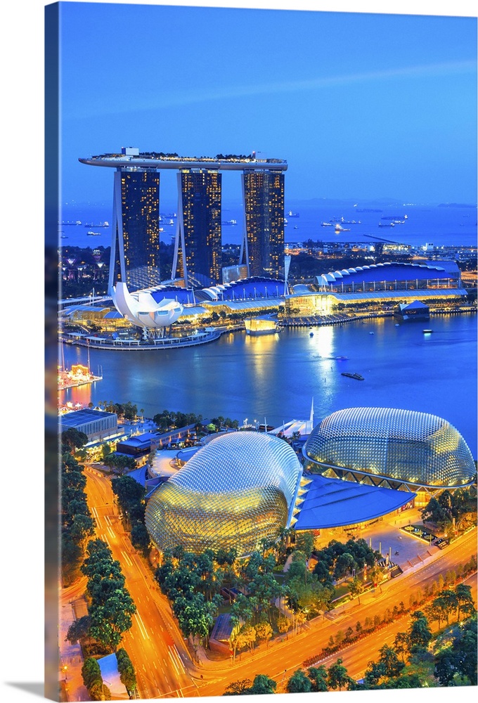 Singapore, Singapore City, Singapore marina with Marina Bay Sands in the background at night.
