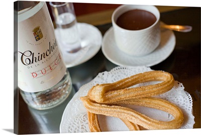 Spain, Madrid, Churros and chinchon, anise liqueur and chocolate