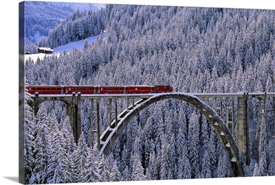 Switzerland, Graubunden, Alps, Arosa Express train across the bridge near Langwies