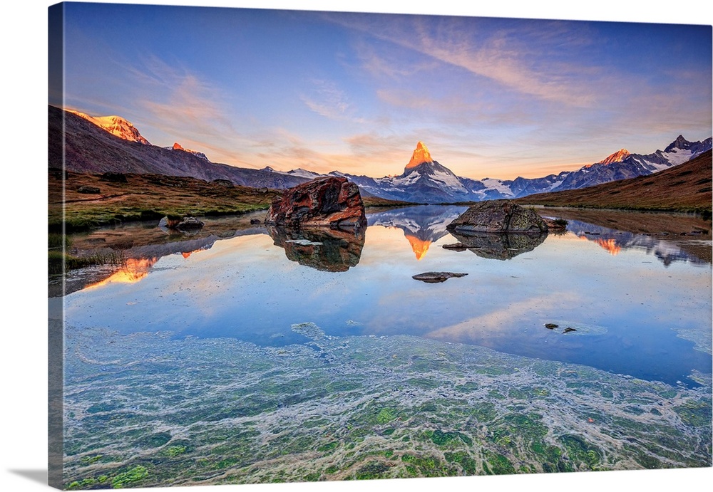 Switzerland, Valais, Zermatt, Alps, Matterhorn (4478m), The Matterhorn reflected in Lake Stellisee at dawn Zermatt Pennine...