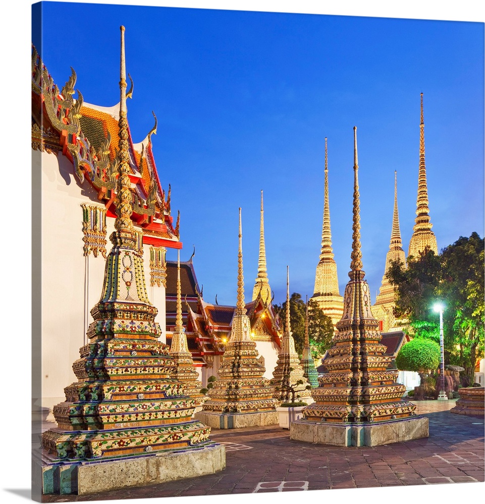 Thailand, Central Thailand, Bangkok, Wat Pho, Temple of the Reclining Buddha illuminated at dusk.