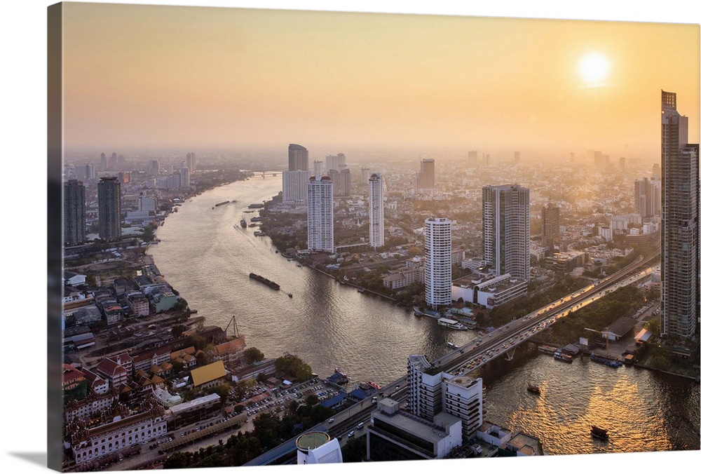 Thailand, Central Thailand, Bangkok, City skyline with Chao Phraya river at sunset.