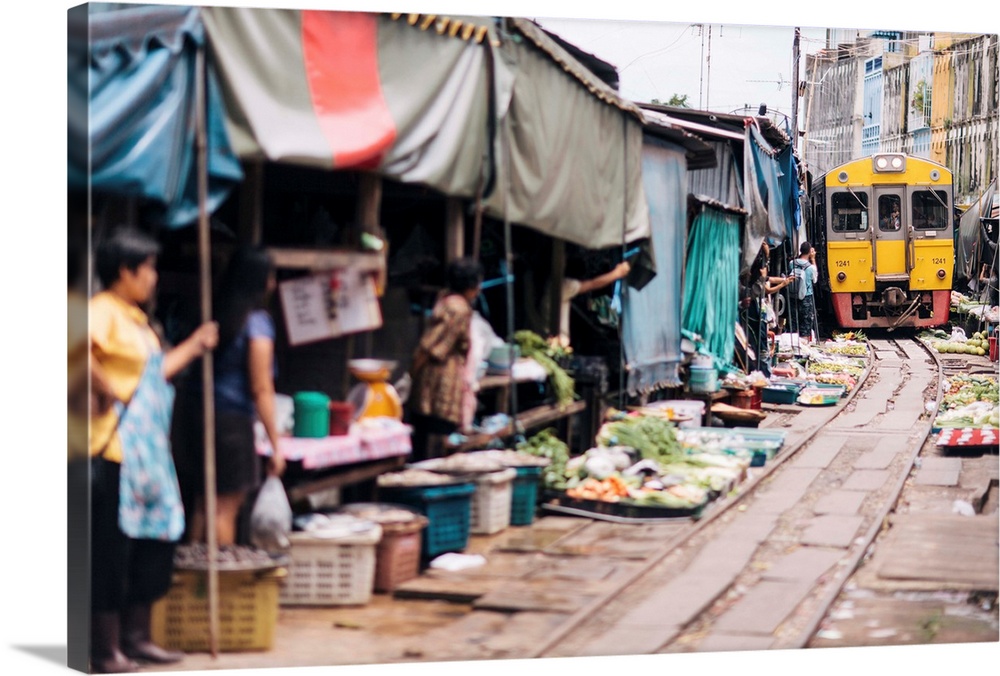 Thailand, Thailand Central, Samut Songkhram, Talad Rom Hoop, Maeklong Railway Market, traders clearing the tracks as the t...