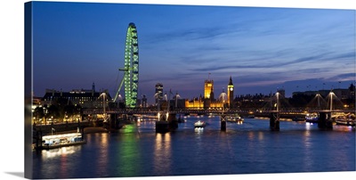 UK, London, London Eye and Westminster Palace skyline at dusk