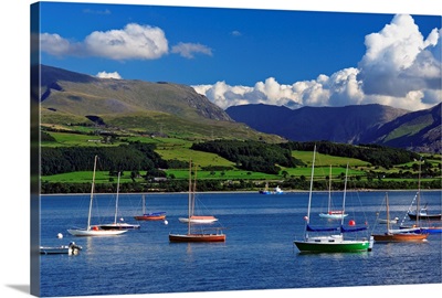 UK, Wales, Anglesey, Sailing boats in the Menai Strait, with the Snowdon range