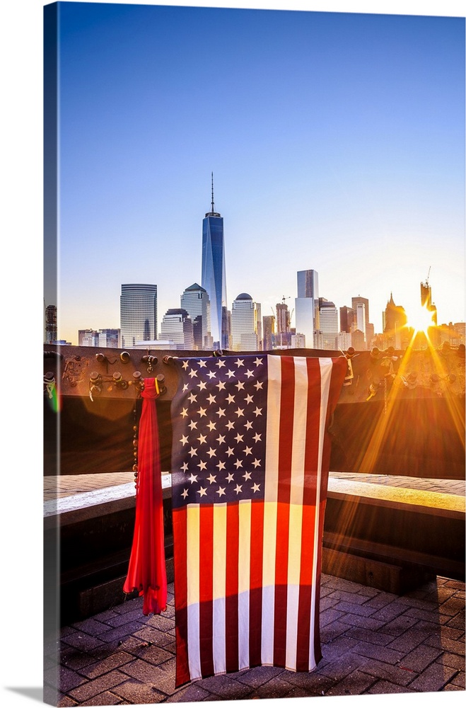 USA, New Jersey, 9-11 memorial in New Jersey, American flags on a steel bar of the destroyed Twin Towers with the One Worl...