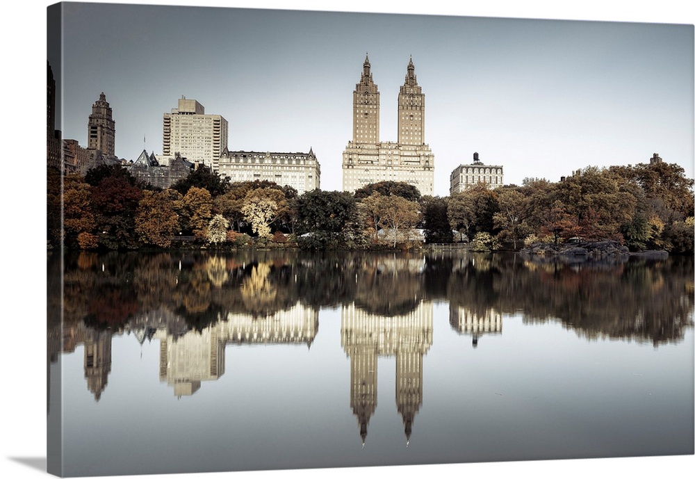 USA, New York City, Central Park, The lake and San Remo apartment building, foliage.
