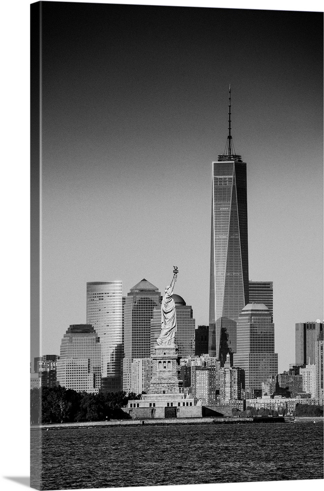 USA, New York City, Lower Manhattan, Lower Manhattan skyline with Freedom Tower and Statue of Liberty.