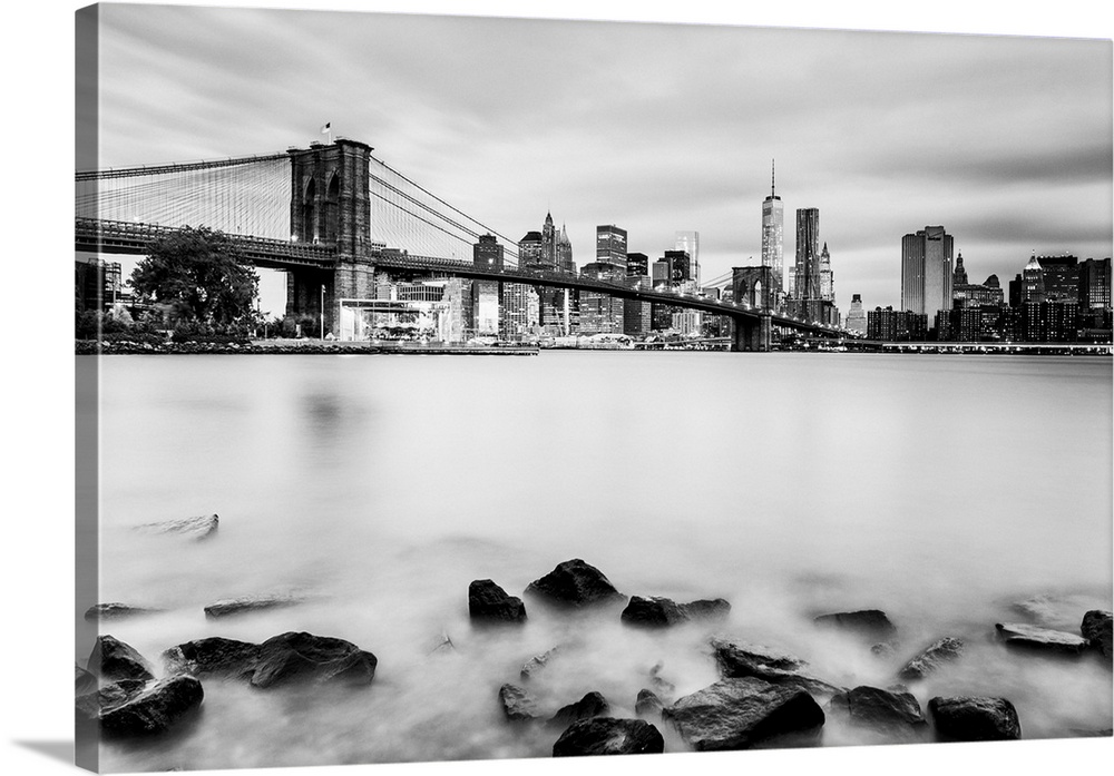 USA, New York City, Brooklyn Bridge, View towards Lower Manhattan skyline at dawn from Dumbo.