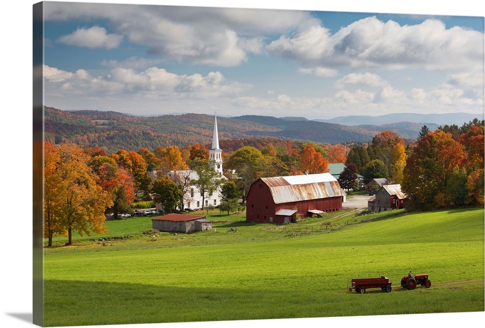USA, Vermont, Peacham, New England, Tractor passing the village in the fall.