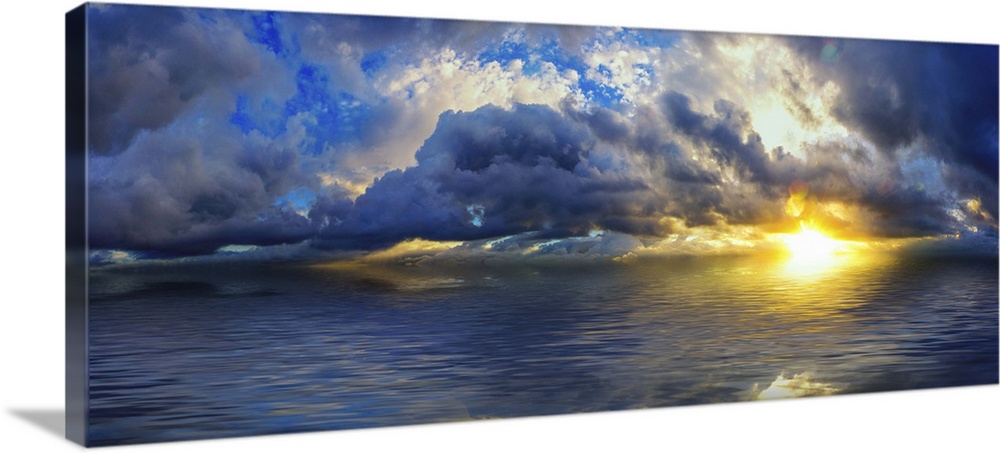 An amazing blue cloudscape within a panoramic sunset with a blue sky reflected in the ocean waters.