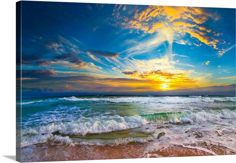 This beautiful beach sunset pictures the eternal sea as it disappears into a beautiful yellow sunset. Crashing waves hit t...