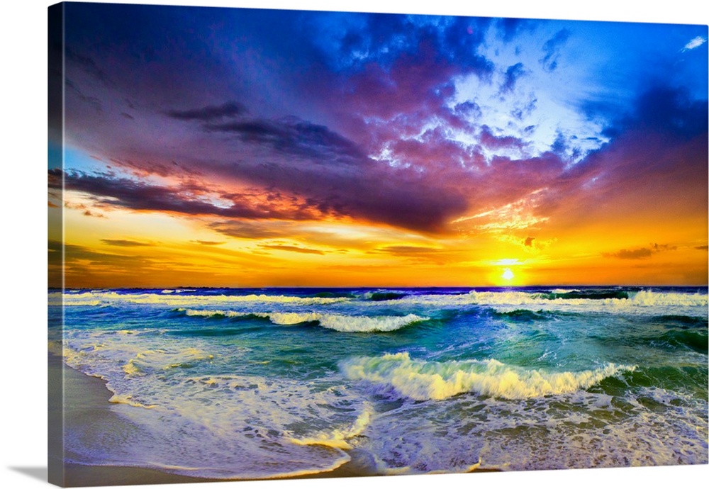 A beautiful sunset sea in this Purple Sunset landscape. Waves roll into the beach before a beautiful sunset with expansive...