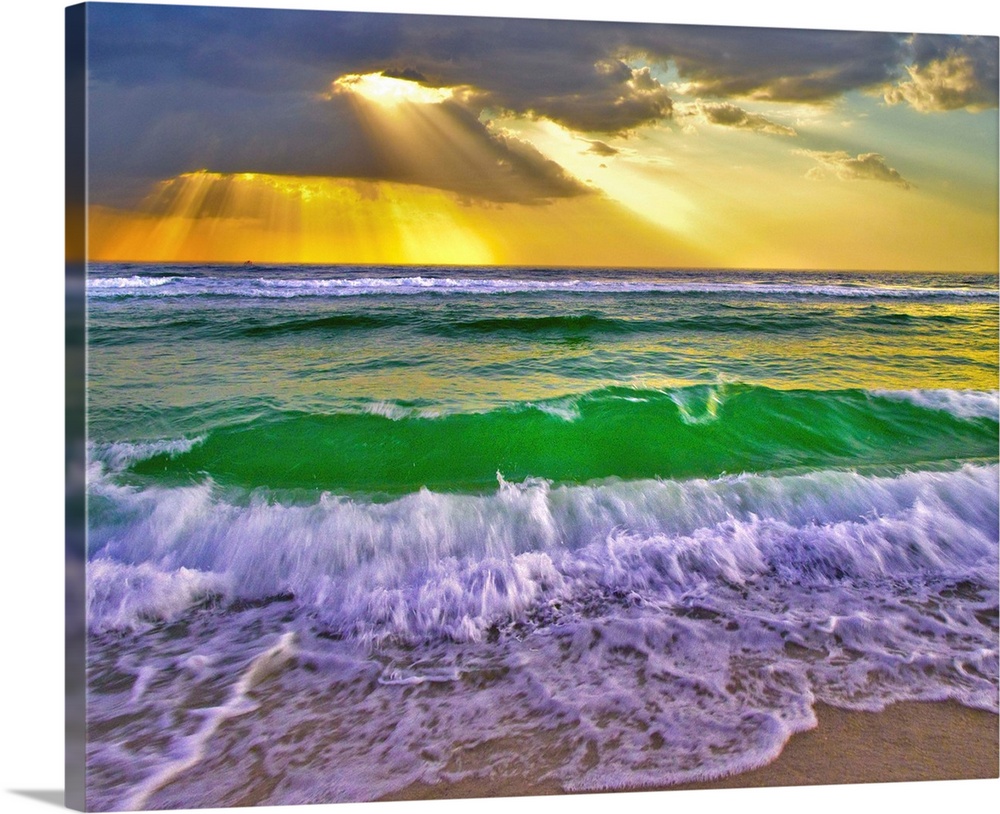 Emerald green breaking waves at sunset crash under golden sunrays. Taken in Fort Walton Beach Florida.