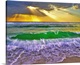 image thumbnail of Emerald green breaking waves at sunset crash under golden sunrays. Taken in Fort Walton Beach Florida.