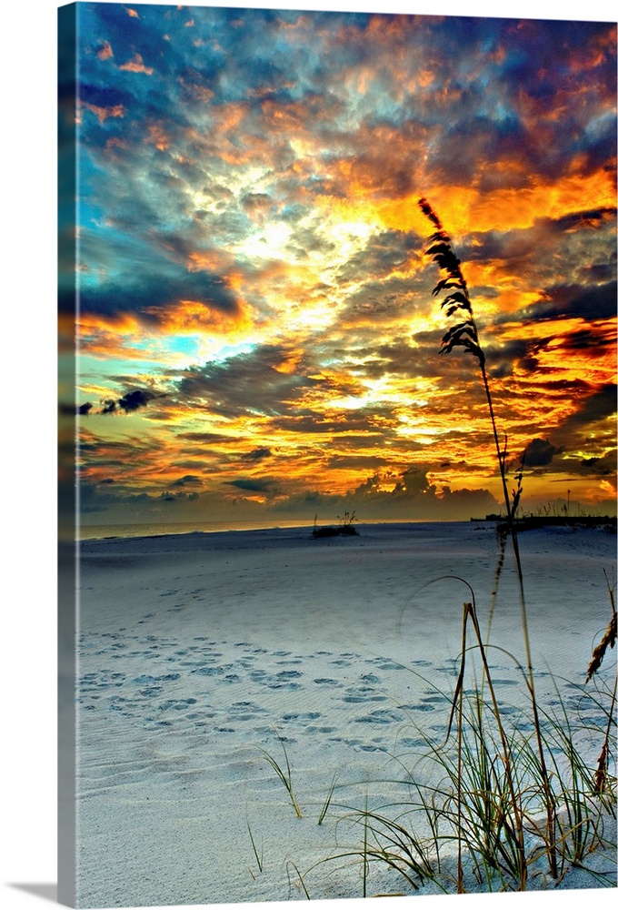 A fiery red sunset on a beach in Destin, Florida.