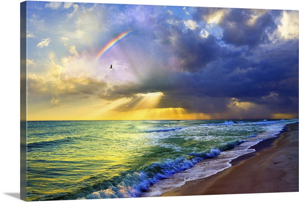 A rainbow seascape of green and blue sea and golden sun rays. Landscape taken near Navarre Beach, Florida.