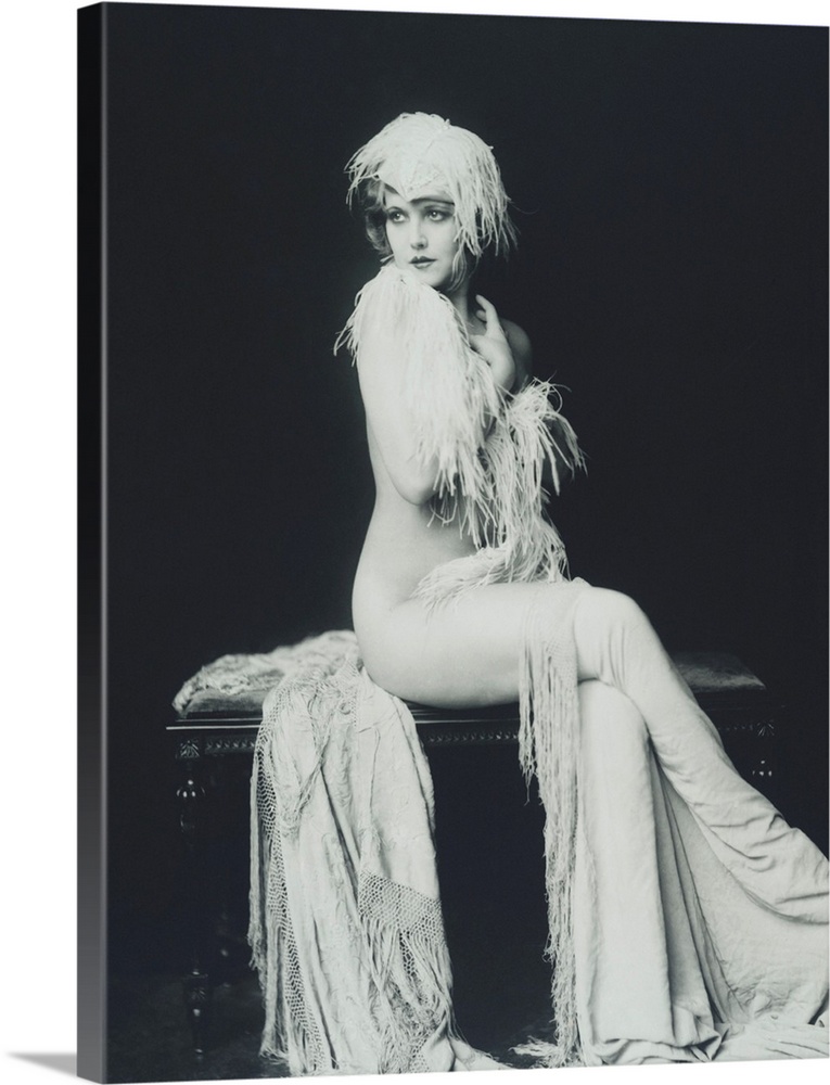 Actress and Ziegfeld girl Claudia Dell. Full length portrait of Dell nude and draped in feathers and cloth. Ziegfeld claim...