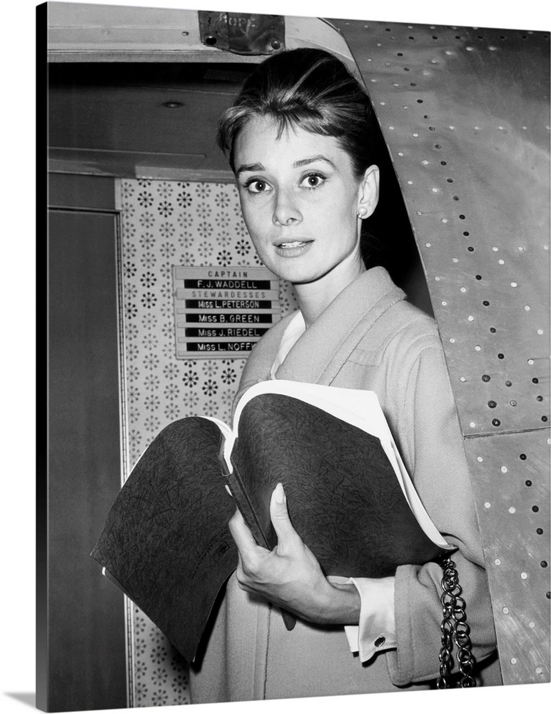 Audrey Hepburn, with her script for BREAKFAST AT TIFFANY'S, returning to Los Angeles from New York location filming, Octob...