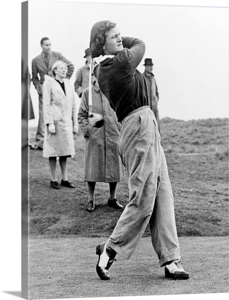 Babe Didrikson, watching golf ball as she completes her swing. The multisport athlete was playing at the Ladies Amateur Ch...